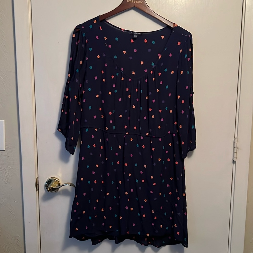 Used dress with skirt lining and open cutout sleeves.